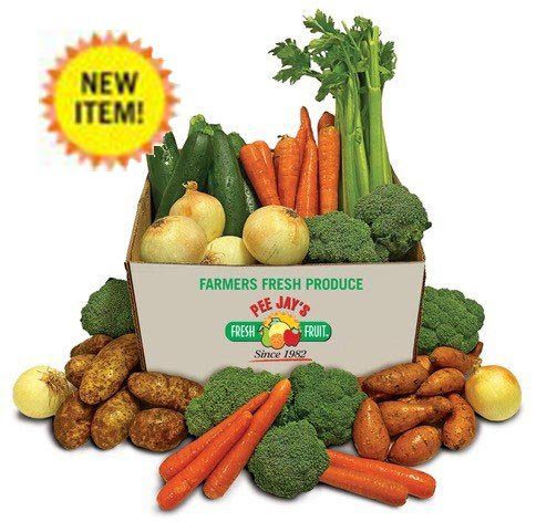 A box of vegetables with potatoes and broccoli.